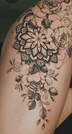 a woman's thigh with flowers on it