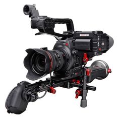 a video camera is attached to a tripod on a white background with red accents