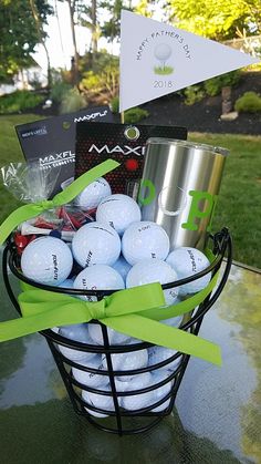 a basket filled with golf balls on top of a table