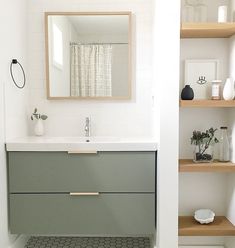 a bathroom with shelving, sink and mirror