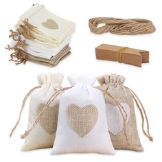 three bags with hearts on them and some twine in the bag next to each other