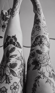 a woman with tattoos on her legs