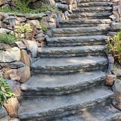 stone steps leading up to a rock wall