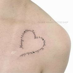 a woman's chest with writing on it and a heart in the shape of a letter