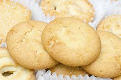 some cookies and muffins are sitting together