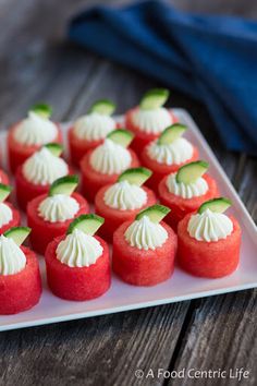 small red and green desserts on a white plate