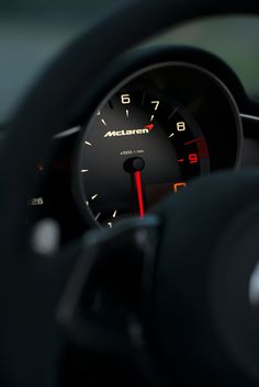 the dashboard of a car is lit up with red and yellow lights