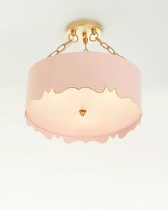 a pink and gold chandelier hanging from the ceiling