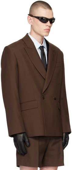 Plain-woven polyester- and virgin wool-blend blazer. · Peaked lapel · Double-breasted button closure · Welt pocket at chest · Flap pockets at waist · Padded shoulders · Four-button surgeon's cuffs · Central vent at back hem · Full twill lining Supplier color: Brown Professional Single Breasted Outerwear With Lapel Collar, Double Breasted Suit For Workwear, Brown Double Breasted Suit With Welt Pockets For Work, Double Breasted Wool Suit With Single Button For Work, Wool Double Breasted Suit With Single Button For Work, Fall Double Breasted Suit With Lapel Collar, Double Button Lapel Collar Sport Coat For Work, Business Blazer With Double Button Closure And Suit Collar, Career Suits With Single Breasted Lapel Collar