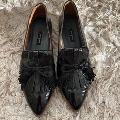 Never Worn Black Leather Tassel Loafers For Office, Black Slip-on Tassel Loafers With Rubber Sole, Black Leather Tassel Loafers With Almond Toe, Black Tassel Loafers With Rubber Sole, Black Loafers With Brogue Detailing And Almond Toe, Black Brogue Loafers With Almond Toe, Black Tassel Loafers With Brogue Detailing, Black Almond Toe Loafers With Brogue Detailing, Black Pointed Toe Loafers With Brogue Detailing