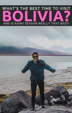 a woman standing on top of a rock next to the ocean with text overlay that reads, what's the best time to visit bolivia and is rainy season really that bad?