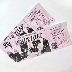 two pink tickets with the words ready to be written on them, sitting next to each other