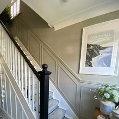 the stairs are painted white and have black railings