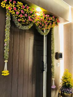 a doorway decorated with flowers and hanging decorations