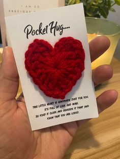 a card with a crocheted heart in the shape of a heart on it