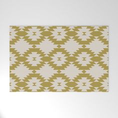 a beige and white rug with triangles on it