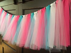 colorful tulle streamers hanging from the ceiling