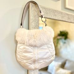 Coach Vintage Fur Trim Satin Exterior Coach Design Signature Coach Tag Included Two Pockets Inside, One With A Zipper Closure Top Snap Button Closure Thick White Leather Strap Silver Hardware Internal Key Holder Loop White / Ivory Gorgeous Bag Minor Wear Present On Side Suede Detail ~12” X ~10” Strap Drop: ~8” If You Are Brand New To Poshmark, Use Code Cem_poshmark At Checkout For $10 Off Your First Order. White Coach Shoulder Bag For On-the-go, Coach Cream Pouch Shoulder Bag, Coach Cream Bag With Detachable Handle, White Coach Pouch Shoulder Bag, Coach White Pouch Shoulder Bag, White Coach Pouch Bag, Coach Cream Shoulder Bag With Top Carry Handle, White Pouch Shoulder Bag With Top Carry Handle, Coach Cream Bag For Errands