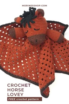 a crocheted horse is laying on top of a blanket with the words crochet horse love written below it