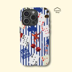 an iphone case with playing cards and dices on the cover, in blue stripes