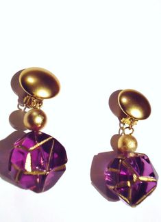 These are so fun. Love the purple with gold.They are 2 and a half inches long.Feel great on. Not heavy...just right.And they don't pinch like most clip on earrings.All you need now is white Go-Go boots. Purple Pierced Earrings For Party, Party Purple Pierced Earrings, Retro Purple Jewelry For Gifts, Vintage Purple Earrings For Party, Cheap Retro Purple Earrings, Purple Clip-on Earrings For Party, 60s Twiggy, Handmade Retro Gold Clip-on Earrings, Purple Clip-on Earrings