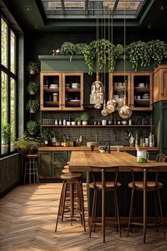 a kitchen with green walls and wooden floors