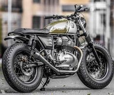 a motorcycle is parked on the street in front of some buildings