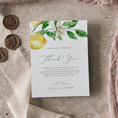 a wedding thank card with lemons and leaves on it next to two wax seals