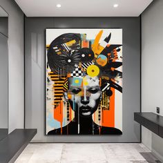 an abstract painting on the wall next to a counter in a room with gray walls