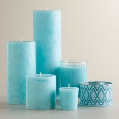 several blue candles are sitting next to each other