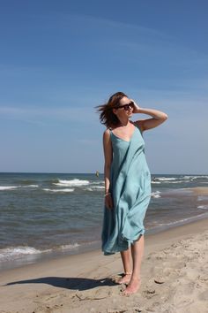 Easy and comfortable linen slip dress for hot summer days at the beach. Perfect dress for beach or dinner party in the city, just change accessories. Click through to see more simple linen dresses. #summerdress #linendress #beachdress Summer Linen V-neck Dress For The Beach, Spring Linen Maxi Sundress, Sleeveless Maxi Dress For Beach Daywear, Sleeveless Maxi Dress For Beach Season, Sleeveless Spaghetti Strap Dress For Beach Cover-up In Spring, Spring Vacation Sundress In Linen, Linen Beach Dress For Spring Day Out, Spring Linen Beach Dress For Day Out, Summer Linen Sundress, Midi Length