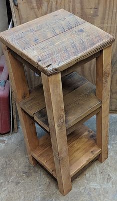 a small wooden table sitting on top of a hard wood floor