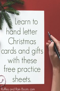 a hand holding a pen and writing on a piece of paper with the words learn to hand letter christmas cards and gifts with these free practice sheets