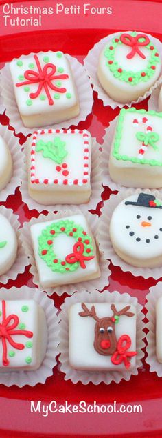 some decorated cookies are on a red plate