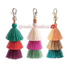 three tasseled keychains in different colors