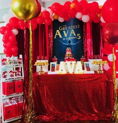 a red and gold birthday party with balloons