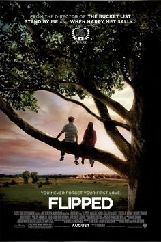 a movie poster with two people sitting on a tree and the words flipped in front of them