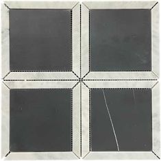 four square black and white tiles with squares on them, all in the same pattern