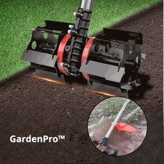 an image of a garden pro attachment on the ground with green grass in the background