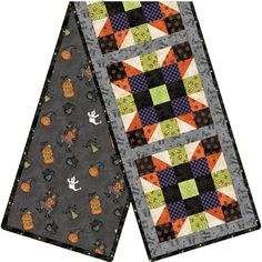 two quilts with different designs on them, one is black and the other is orange