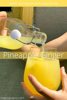 someone is pouring pineapple ginger juice into a glass with the caption happy gutter kefir soda recipe