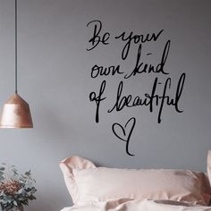 a bedroom with a wall decal that says, be your own kind of beautiful