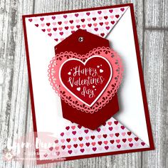 a valentine's day card with a heart shaped tag