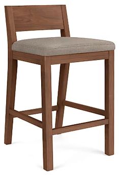 a wooden bar stool with a beige upholstered seat and back cushion on an isolated white background