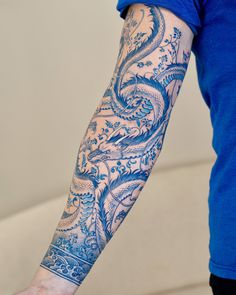 a person with a tattoo on their arm