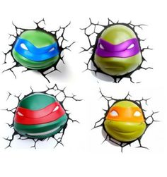 four different colored balls in the shape of teenage mutant turtles