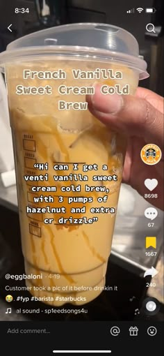 someone is holding up a cup with ice cream in it and the text, french vanilla sweet cream cold brew