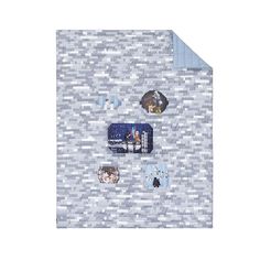 a white and blue mosaic tile wall with several pictures on the side, all over it