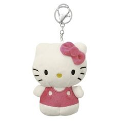 a hello kitty keychain with a pink dress on it's front and side