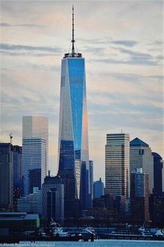 the skyline of new york city with one world trade center in the foreground